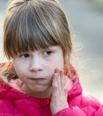 Durere de maxilar la copil: cauze și tratament