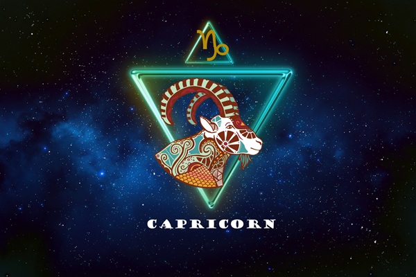 semn zodia capricorn incadrat in triunghi pe fundal albastru