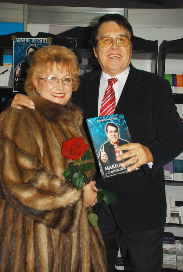 marius teicu in costum negru si cravata rosie impreuna cu angela similea